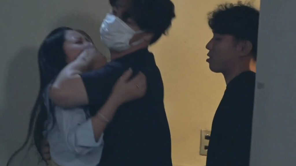 Mina Kitano’s Weird Dynamic With Two Strangers Sparks Curiosity