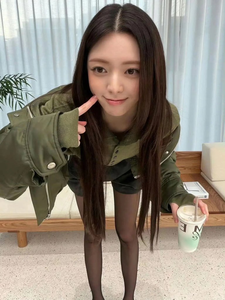ITZY Yuna’s Green Sweater and Black Skirt Gives Off College Vibes